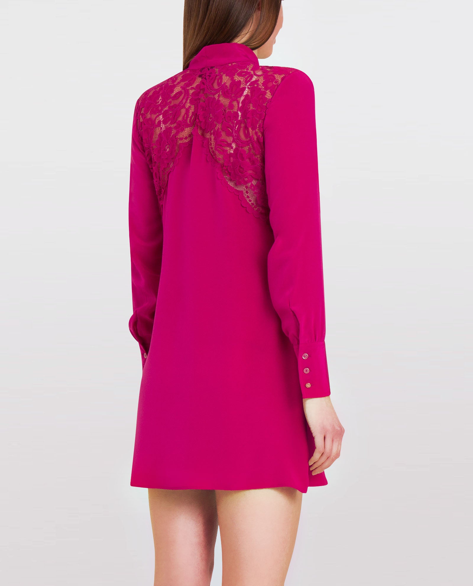 Back of a berry pink silk bow mini dress