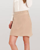 Front of beige silk mini skirt